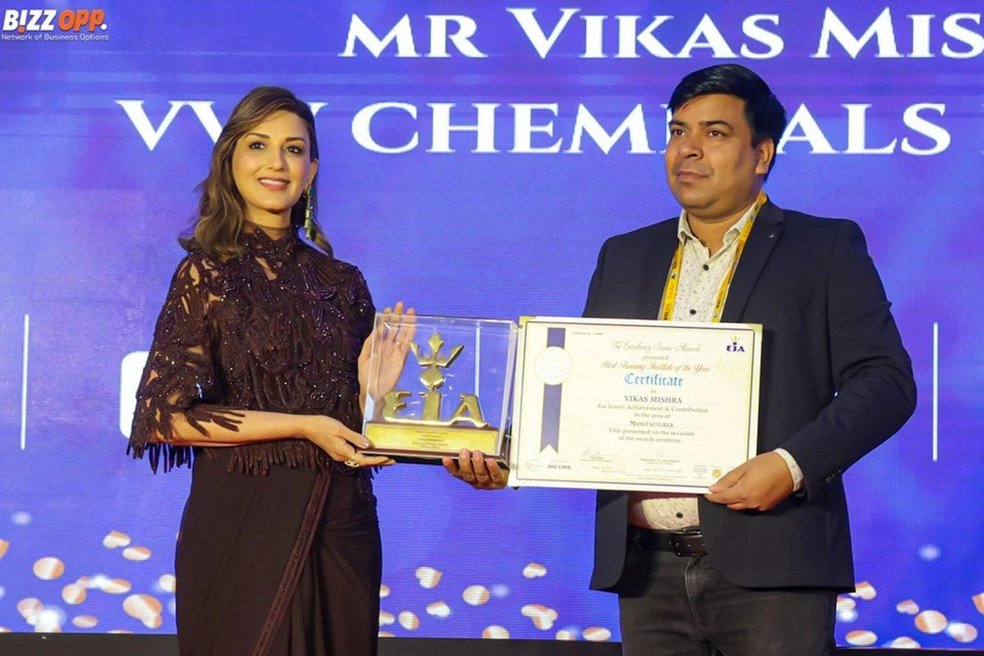 Vikas Mishra receiving an award and certificate